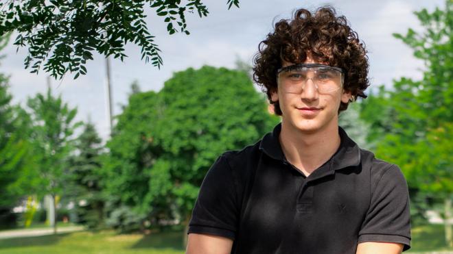 Young person outdoors wearing goggles