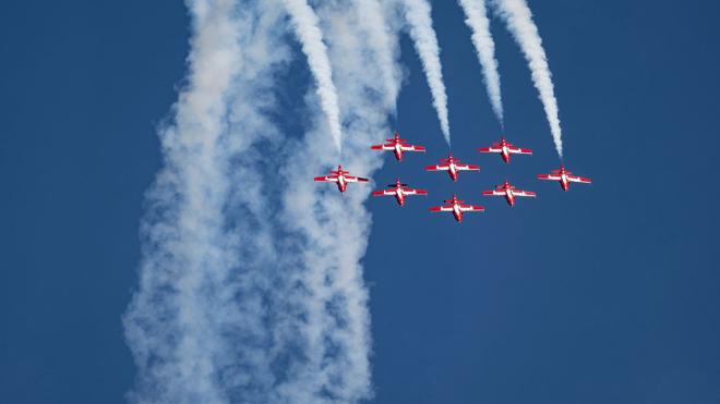 8 jets flying through blue sky 