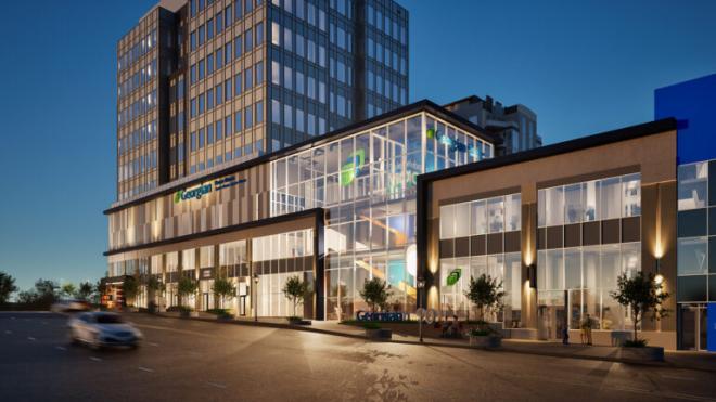 Rendering of a modern Geoergian College building lit warmly at dusk.